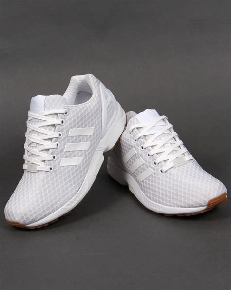 white female adidas trainers.